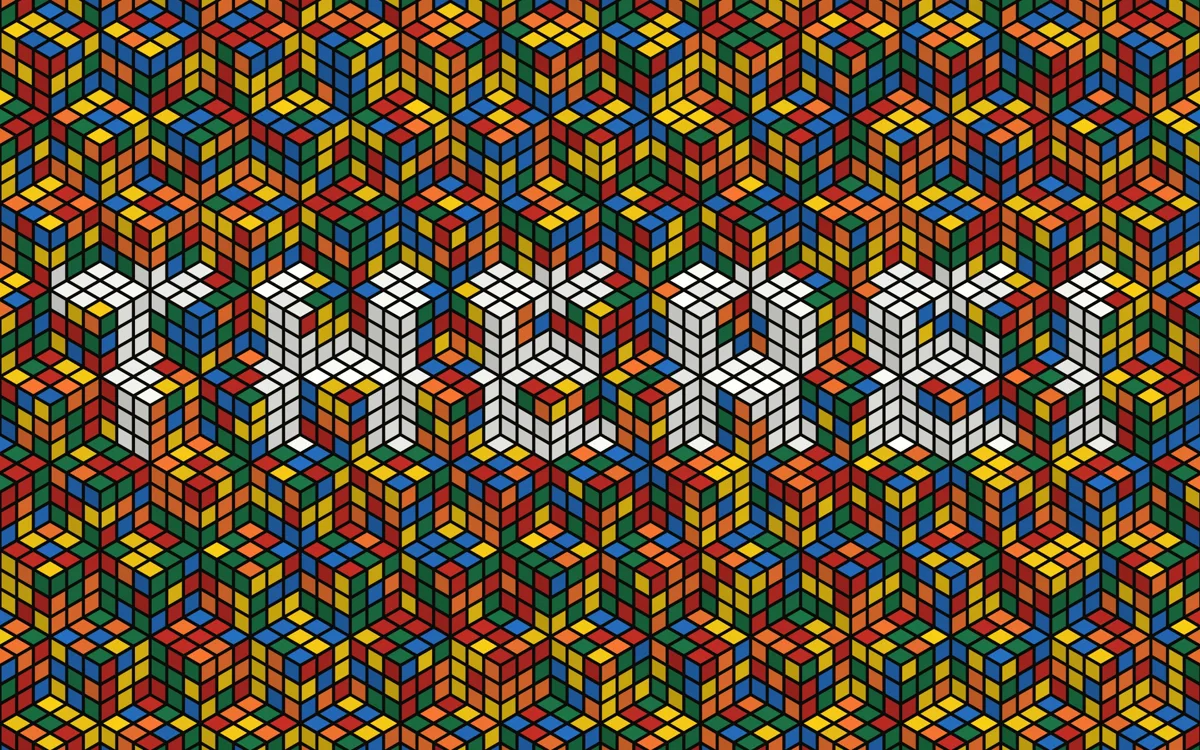 Tumblewall: a wall of Rubik's cubes tumbling to spell out the word THERE in white faces.